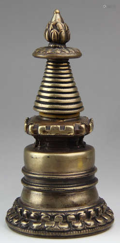 A GILT BRONZE CASTED STUPA