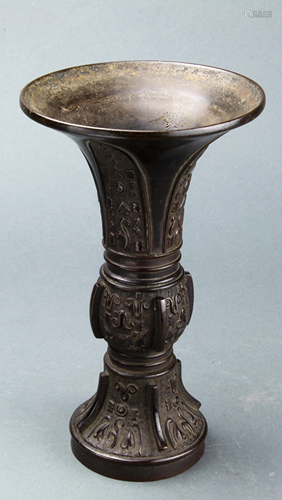 A Chinese Small Bronze Gu-Form Vase, 8.7…