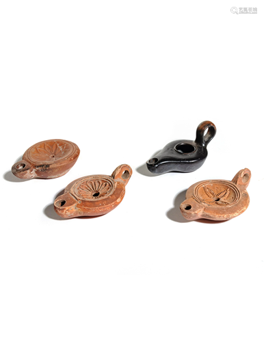 Four Roman Molded Terra Cotta Oil Lamps Wid…