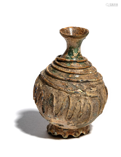 A Late Roman or Islamic Glass Bottle