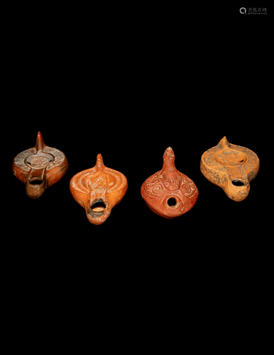 Four Roman Molded Terra Cotta Oil Lamps