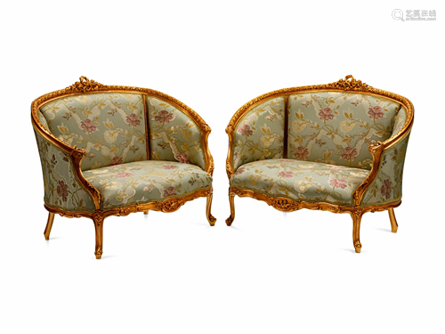 A Pair of Louis XV Style Giltwood Petit Canap…