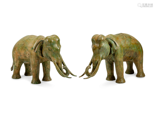 A Large Pair of Patinated Bronze Elephants…