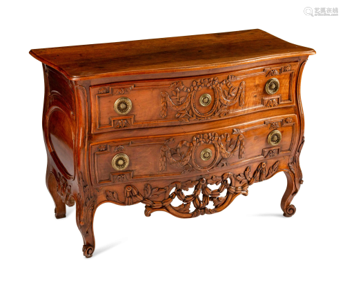 A Louis XV Provincial Carved Walnut Commode …