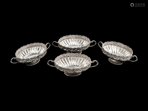 A Set of Four Silverplated Two-Handled …