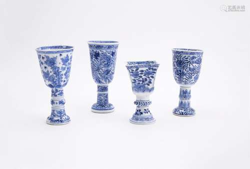 A collection of four Chinese blue and white goblets in the form of European glass