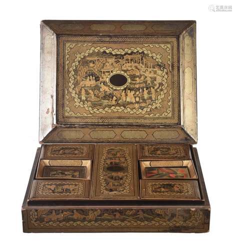 A Chinese export gilt black lacquer games box