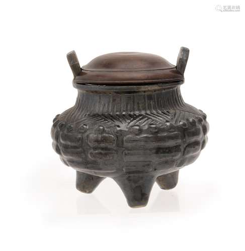 An unusual Chinese black lustred tripod censer