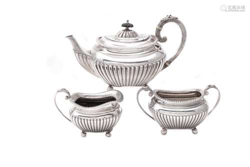 A silver three piece oblong tea set by James Dixon & Son