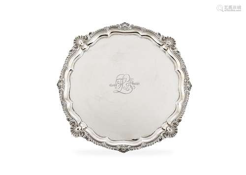 A large Edwardian silver shaped circular salver by Harrison Brothers & Howson