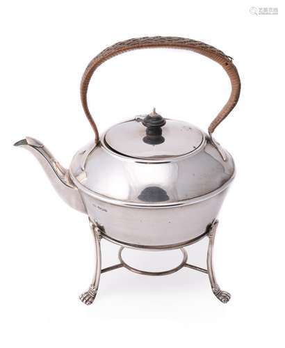 A silver circular tea pot on stand by Harrison Brothers & Howson