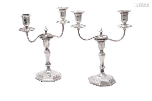 An Edwardian pair of two-branch silver candelabra by Hawksworth