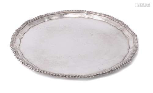 A silver shaped circular salver