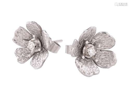 A pair of 18 carat white gold and diamond flower head ear studs