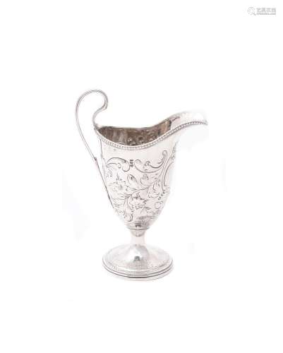 A George III silver helmet shaped cream jug