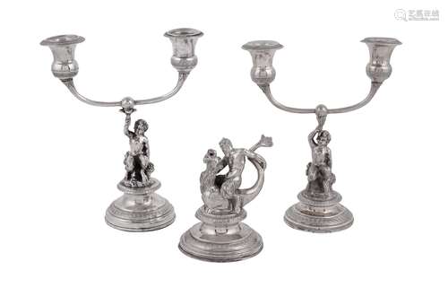 A matched pair of mid 19th century Italian (Papal States) silver coloured candelabra