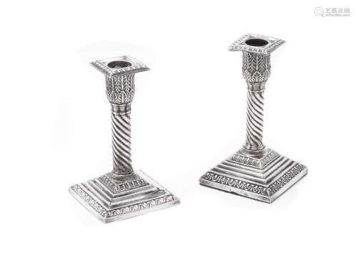 A matched pair of late Victorian silver small candlesticks
