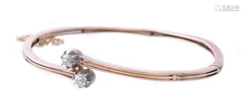 A diamond two stone hinged bangle