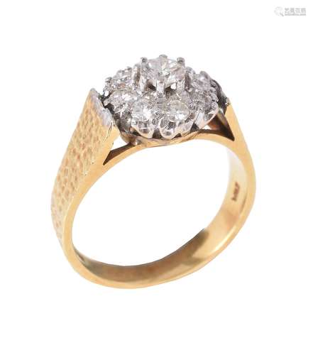 An 18 carat gold diamond cluster ring