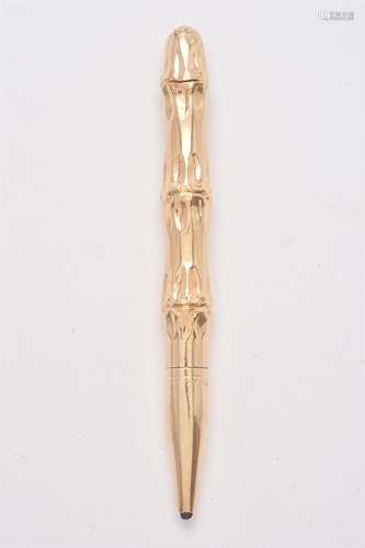 A gold coloured bamboo propelling pencil by T. & Son