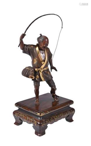 A Japanese Parcel Gilt Bronze Figure of a Fisherman