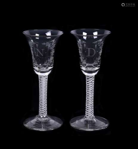 A pair of engraved Low Countries commemorative mixed twist wine glasses