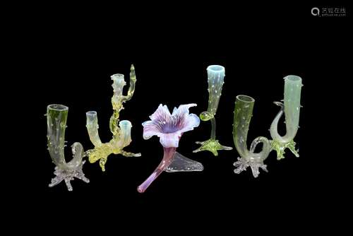 A selection of English 'vasoline' and similar glass flower spills and vases