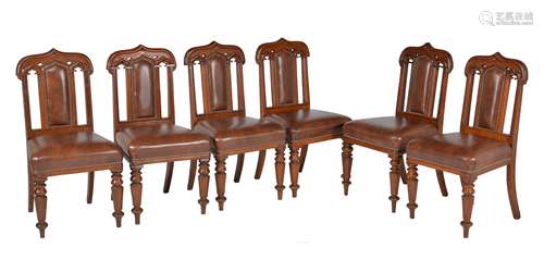 A harlequin set of ten Gothic Revival oak and upholstered dining chairs