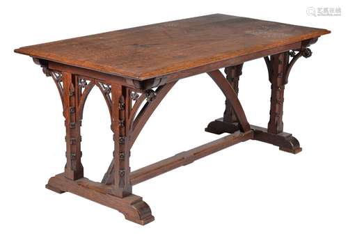 A Victorian Gothic Revival carved oak dining table