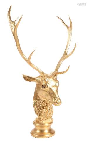 A gold coloured antler and composition model of a stag's head by Anthony Redmile
