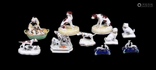 A selection of English pottery and porcelain models of hounds