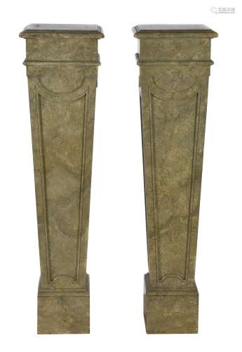 A pair of simulated marble pedestals