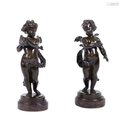 A pair of French patinated bronze models of Cupid and Psyche as infants