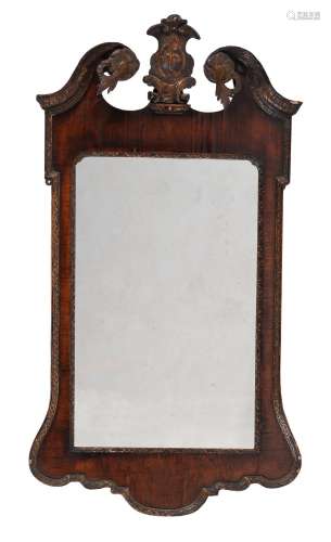 A George II mahogany and parcel gilt wall mirror