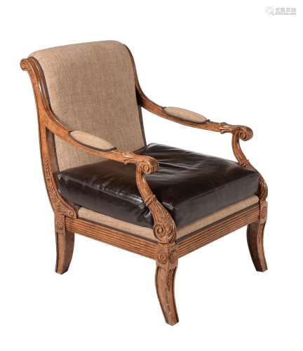 A simulated burr oak and upholstered library armchair in Regency style