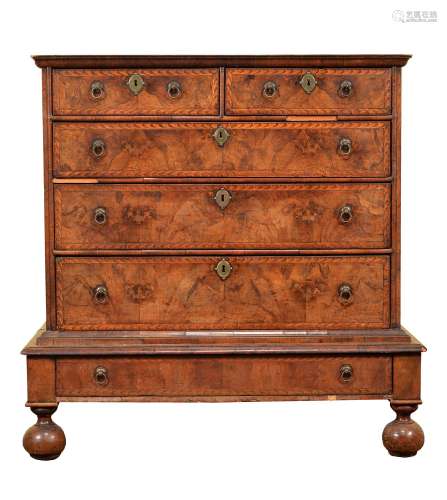 A William & Mary walnut and marquetry banded chest on stand