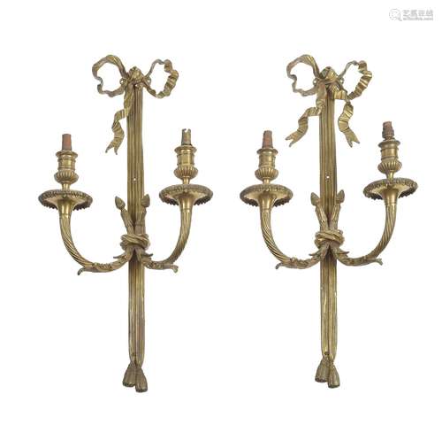 A pair of gilt metal twin light wall appliques in Louis XVI style