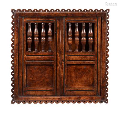 An elm & burr elm mural cupboard in mid 17th century style