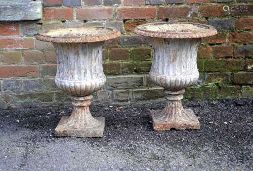 A pair of English or French white painted cast iron jardinieres