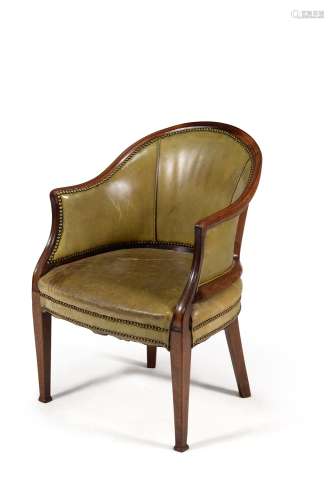 A late George III mahogany and green leather upholstered tub armchair