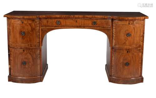 A Regency mahogany and line inlaid serpentine fronted sideboard