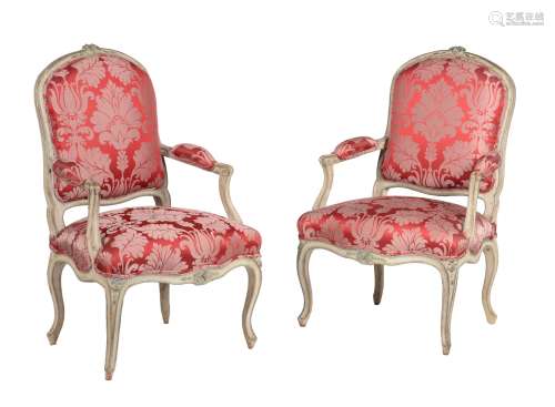 A pair of green painted Louis XV armchairs