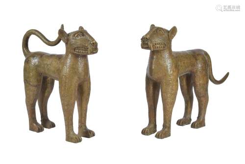 A pair of gold painted metal models of leopards in the style of Benin bronzes