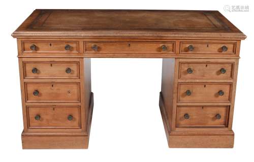 A Victorian walnut pedestal desk with inset leather writing surface