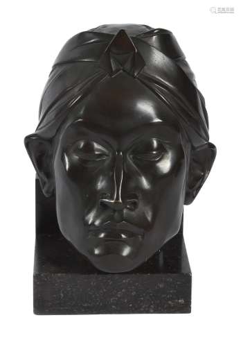 A Dutch patinated bronze relief sculpture of a male mask