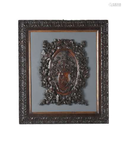 A Victorian carved and stained hardwood armorial plaque