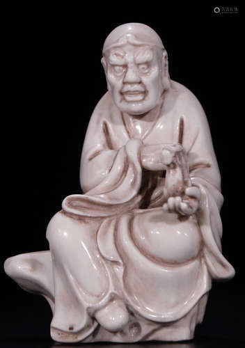 A WHITE GLAZE CARVED ARHAT BUDDHA STATUE