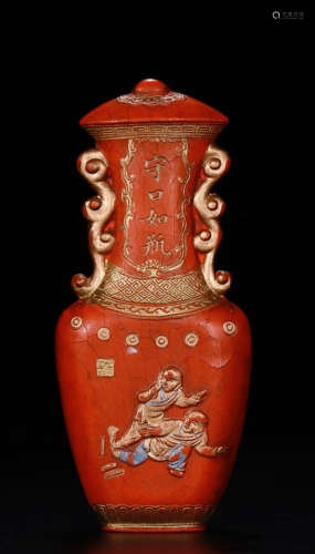 A CINNABAR VASE SHAPED INK STICK