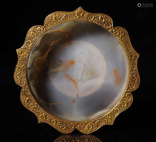 AN AGATE WRAPPED WITH GOLD PLATE