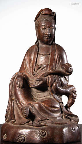 A BAMBOO ROOT CARVED RUYI GUANYIN STATUE